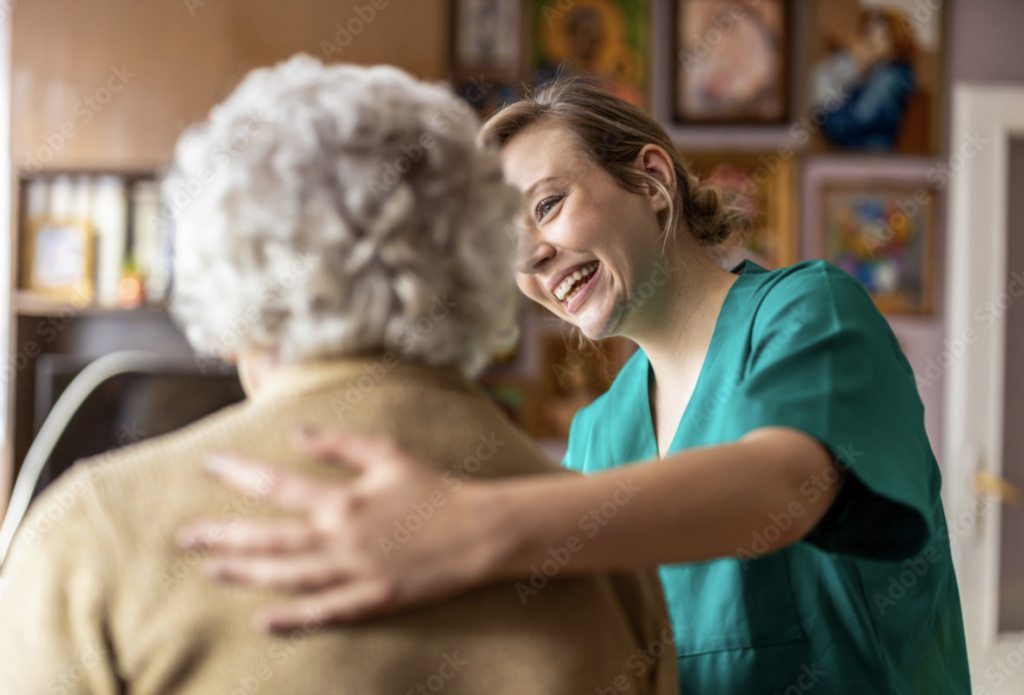 Elders' Helpers employee providing in-home senior care to elderly woman.